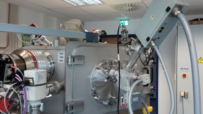Characterization of an RF excited broad beam ion source operating with inert gases